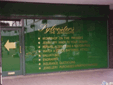Shop window using colour vinyl graphics against a flood coated vinyl background