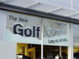 Showroom window sign using removable vinyl graphics
